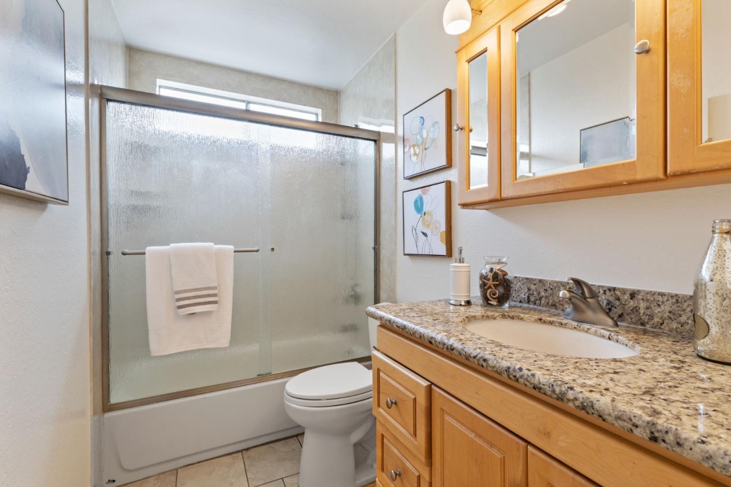 Cadburry Court San Jose, CA 95123 - Photo 20 of 25 a bathroom with a granite countertop sink toilet and shower