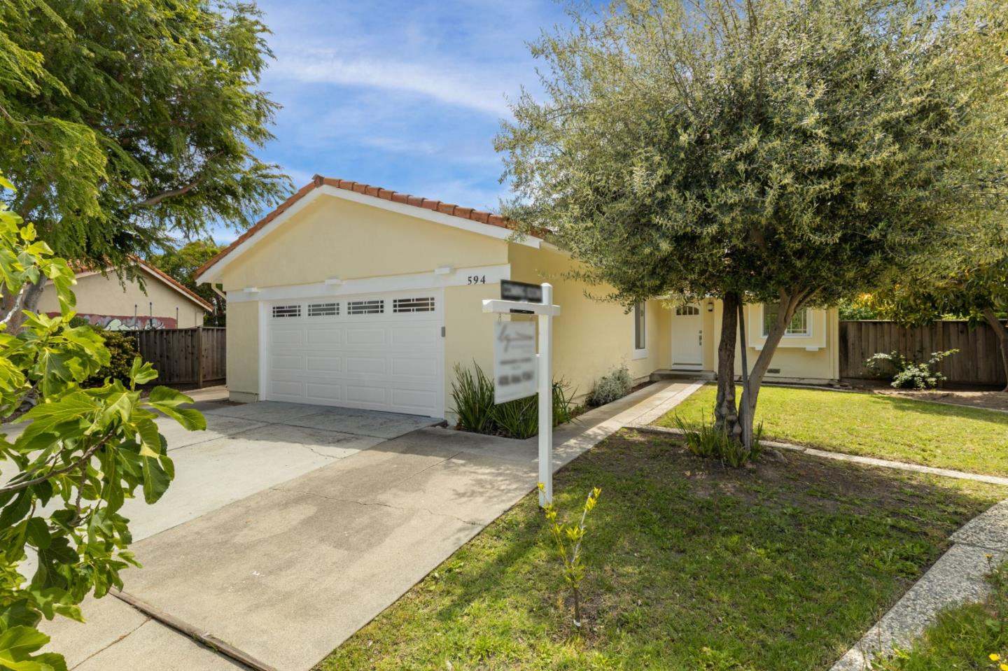 Cadburry Court San Jose, CA 95123 - Photo 2 of 25 a view of a white house next to a yard and a large tree