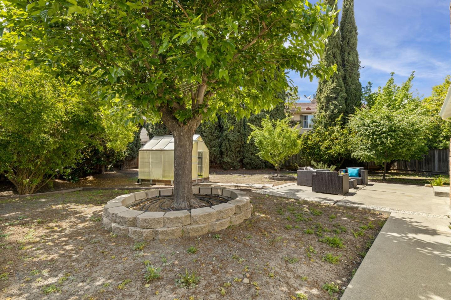 Cadburry Court San Jose, CA 95123 - Photo 22 of 25 a view of a fire pit with large trees