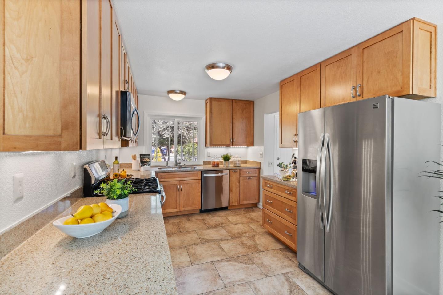 Cadburry Court San Jose, CA 95123 - Photo 10 of 25 a kitchen with sink refrigerator and cabinets