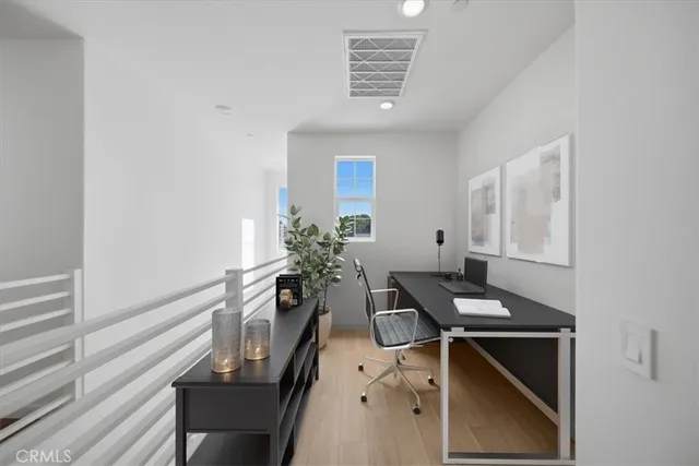 a workspace with furniture and window