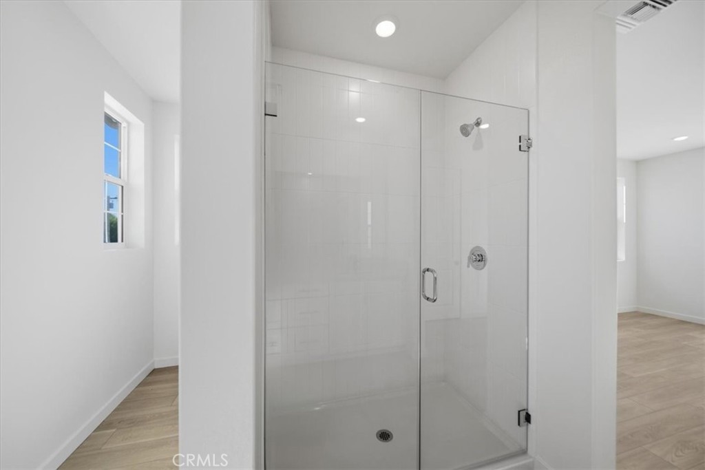 4841 East Beltramo Ranch Road Moorpark, CA 93021 - Photo 17 of 38 a bathroom with a shower and a glass door