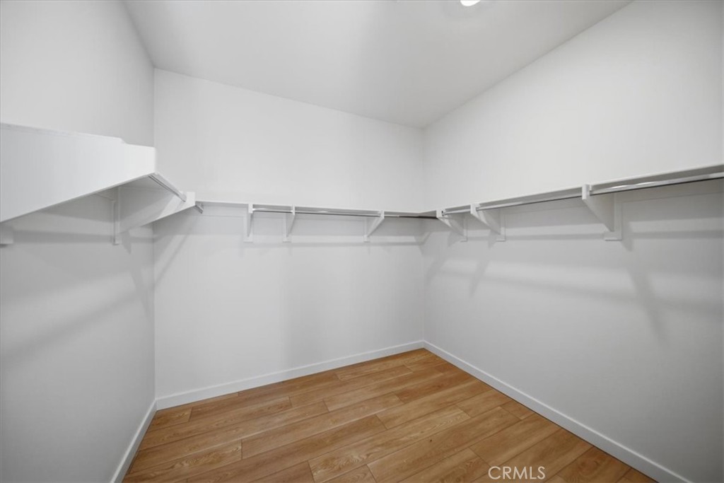 4841 East Beltramo Ranch Road Moorpark, CA 93021 - Photo 18 of 38 a view of a room with shelf on the wall