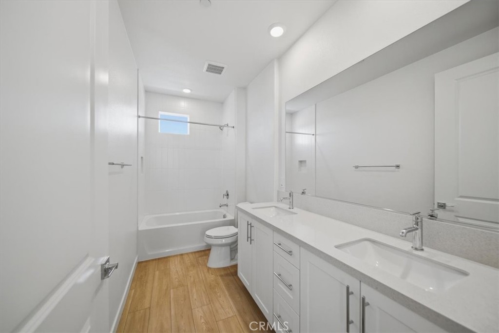 4841 East Beltramo Ranch Road Moorpark, CA 93021 - Photo 20 of 38 a bathroom with a sink a toilet and shower