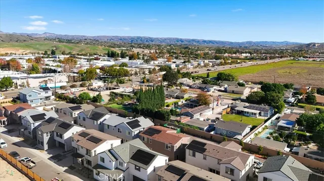 a view of a city with mountains in the background