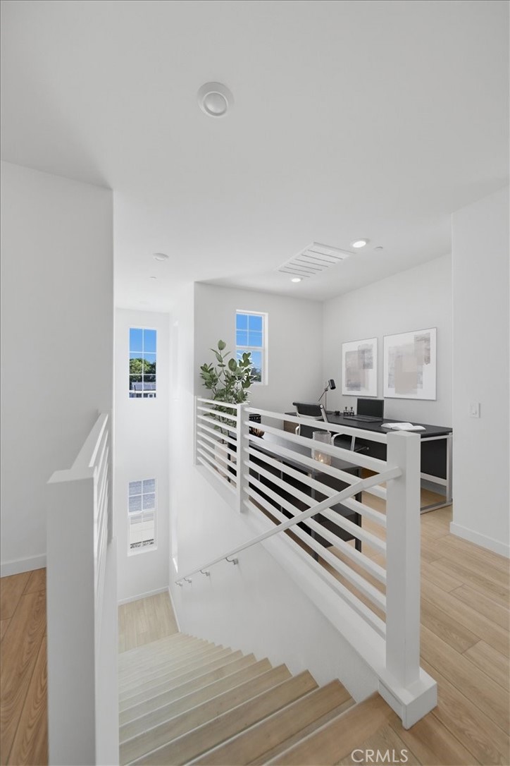 4841 East Beltramo Ranch Road Moorpark, CA 93021 - Photo 36 of 38 a view of a room with wooden floor and stairs