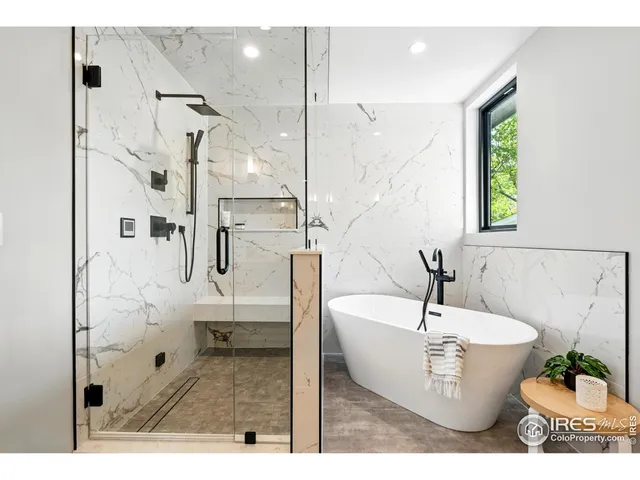 a white bath tub sitting next to a white sink