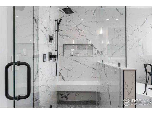 a bathroom with a sink vanity and tub