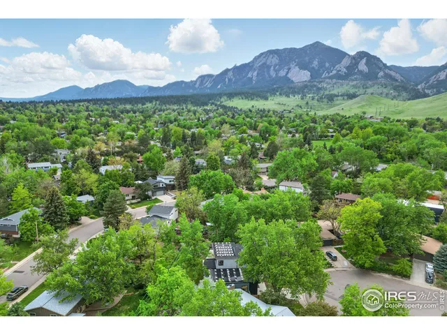 a view of a lush green hillside and a building