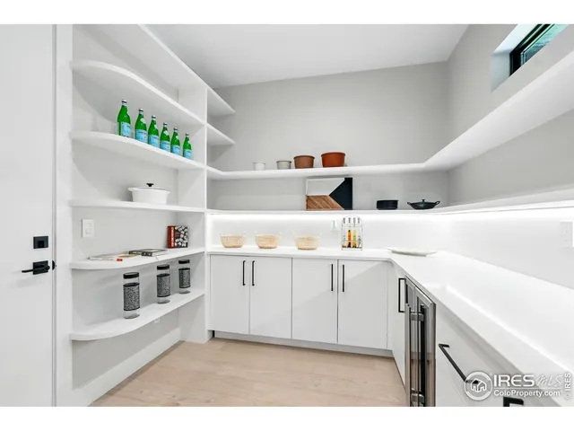 a kitchen with a sink a stove and cabinets