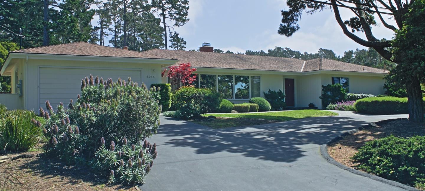 3035 Sloat Road Pebble Beach, CA 93953 - Photo 1 of 16 a front view of a house with garden