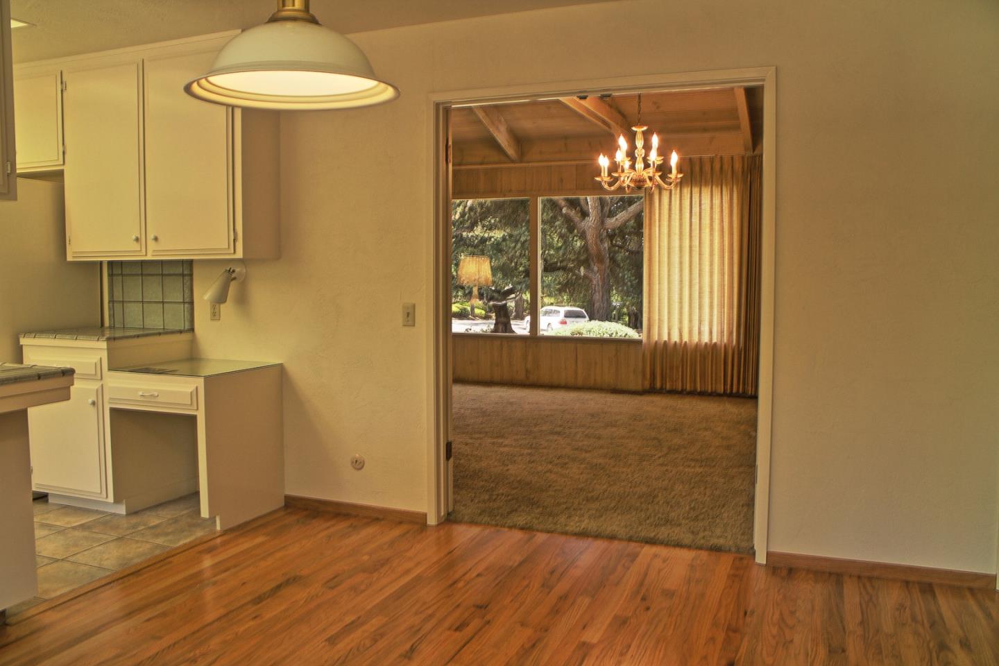 3035 Sloat Road Pebble Beach, CA 93953 - Photo 11 of 16 a view of empty room with wooden floor and fan