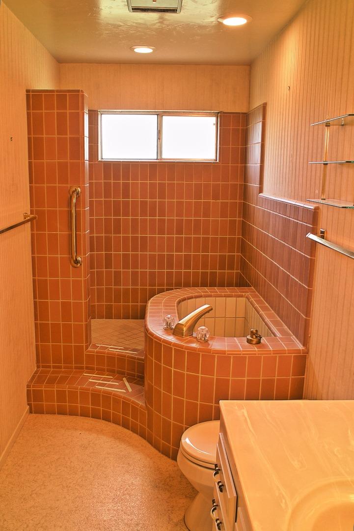 3035 Sloat Road Pebble Beach, CA 93953 - Photo 13 of 16 a bathroom with a blue tub