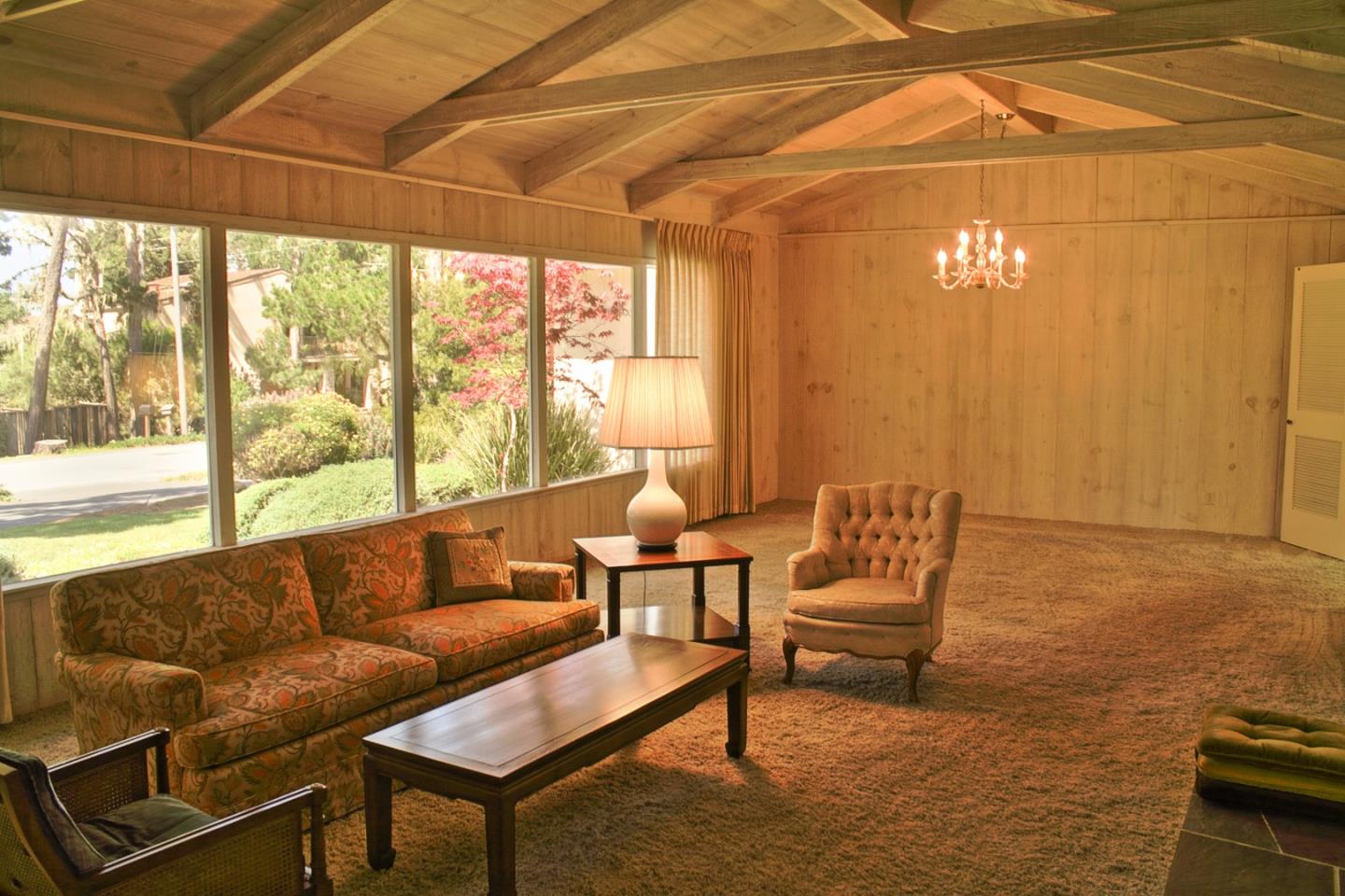 3035 Sloat Road Pebble Beach, CA 93953 - Photo 3 of 16 a living room with furniture and a floor to ceiling window
