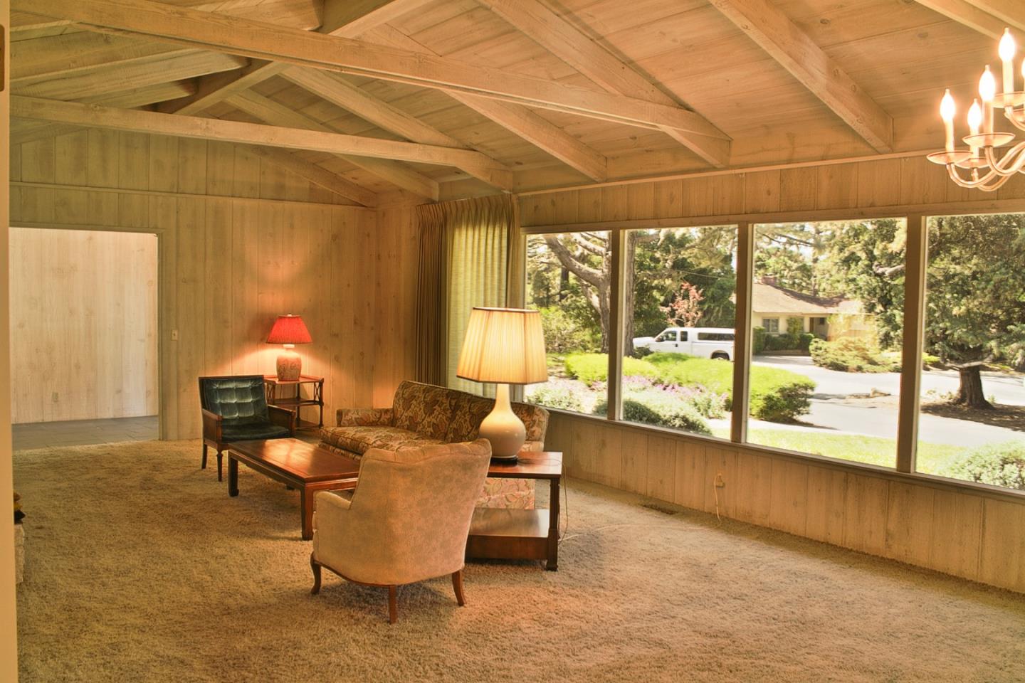 3035 Sloat Road Pebble Beach, CA 93953 - Photo 5 of 16 a living room with furniture and a large window