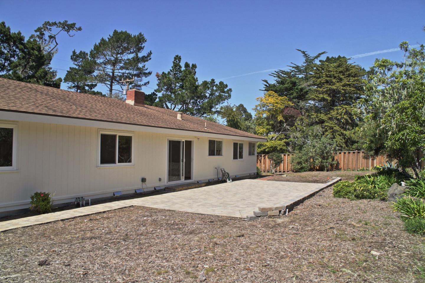 3035 Sloat Road Pebble Beach, CA 93953 - Photo 7 of 16 a house with trees in the background