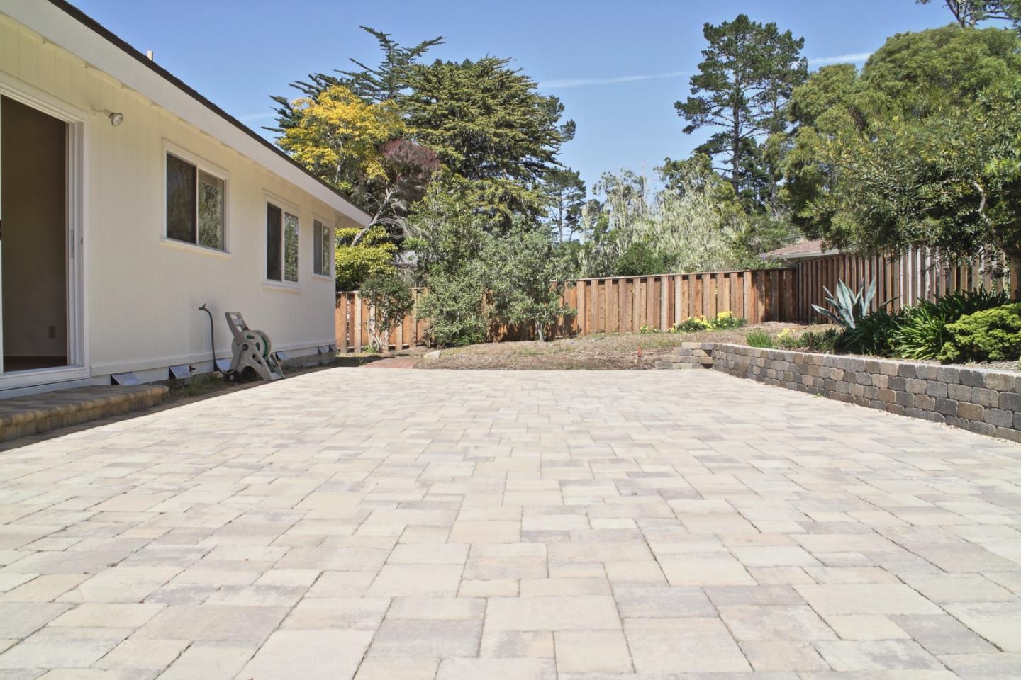 3035 Sloat Road Pebble Beach, CA 93953 - Photo 8 of 16 a backyard of a house with lots of green space