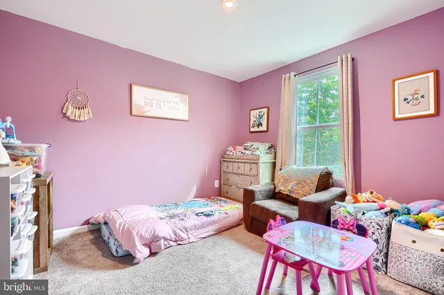 a bedroom with furniture and a bed