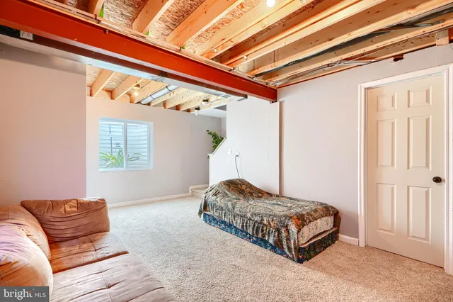 a living room with a bed and a couch