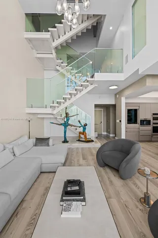 a large bedroom with a bed and a flat screen tv