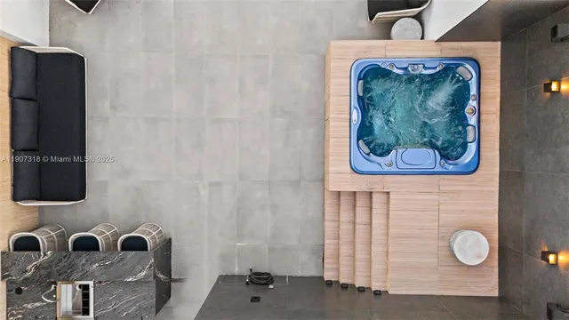 a view of an empty room with window and furniture