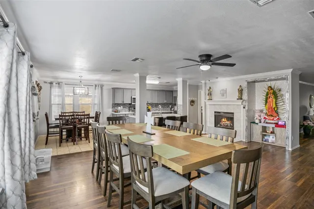 a view of a dining room with furniture wooden floor and chandelier