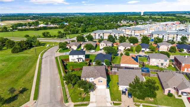 an aerial view of a house with a garden