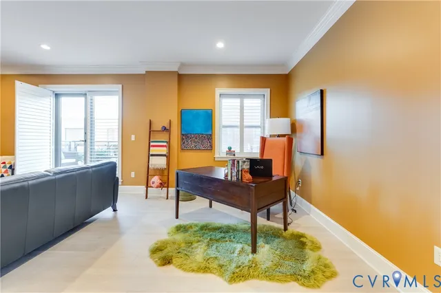 a kitchen with a table chairs and a refrigerator