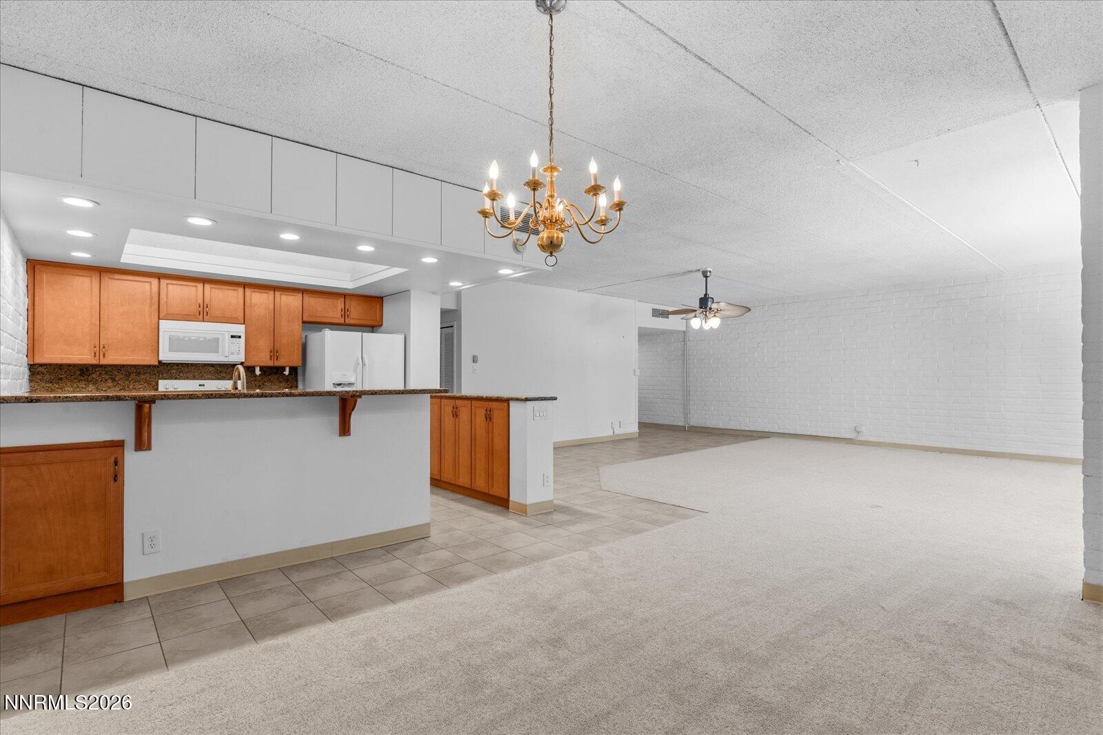1200 Riverside Drive, Unit 1229 Reno, NV 89503 - Photo 23 of 51 a view of a kitchen with a sink and chandelier