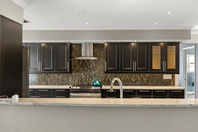 a view of living room kitchen and utility room