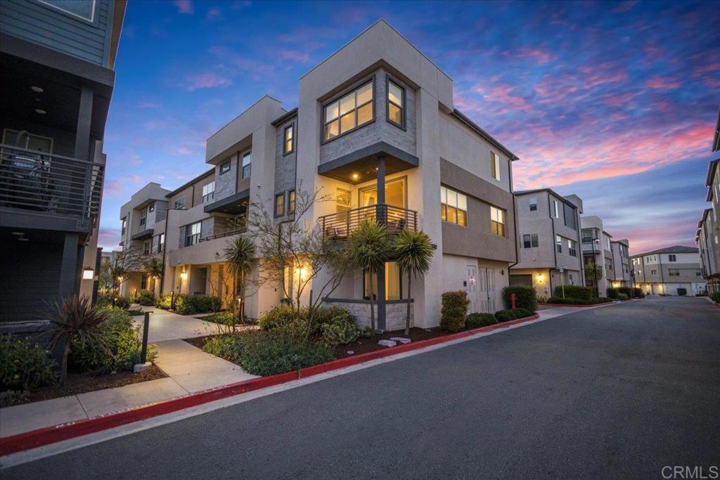 a view of a street with a building in the background