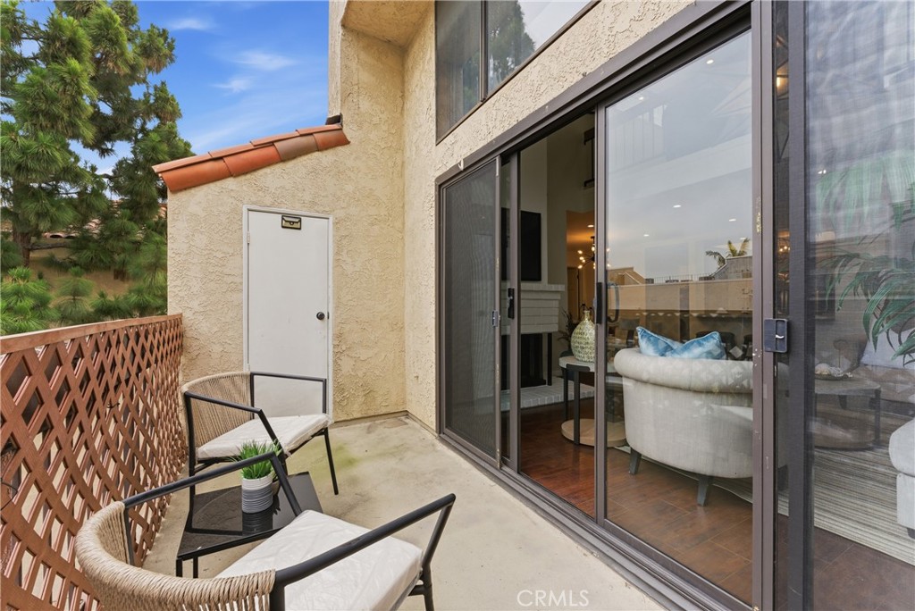 8180 Manitoba Street, Unit 330 Playa del Rey, CA 90293 - Photo 5 of 31 a view of a balcony with furniture
