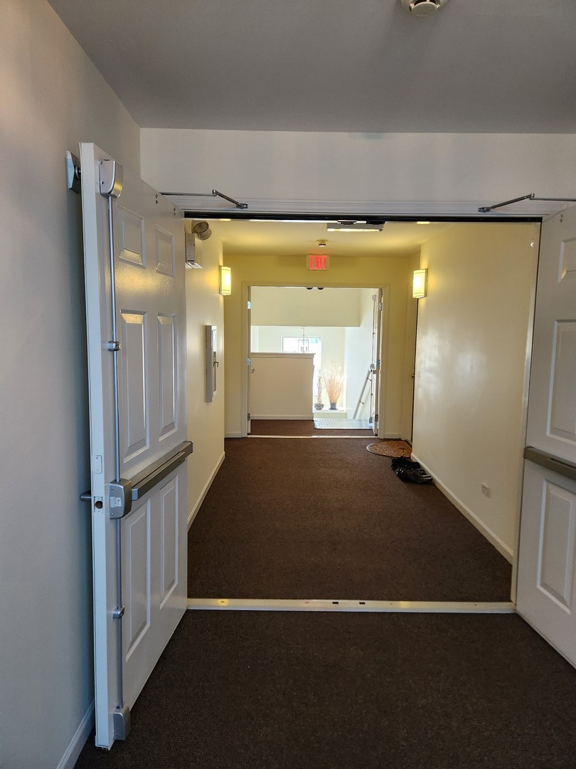 670 Mill Circle, Unit 305 Wheeling, IL 60090 - Photo 4 of 16 wooden floor in a gallery