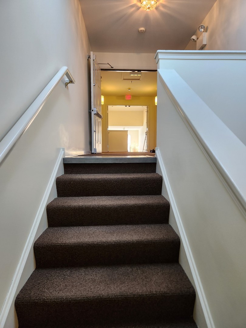 670 Mill Circle, Unit 305 Wheeling, IL 60090 - Photo 5 of 16 a view of entryway and hall with wooden floor