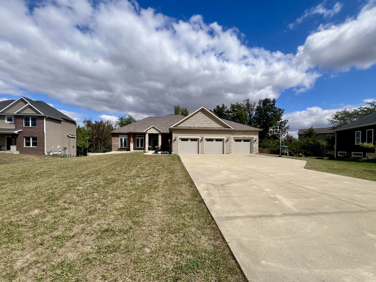 2112 Slade Lane Mahomet, IL 61853 - Photo 1 of 68 a front view of a house with a yard