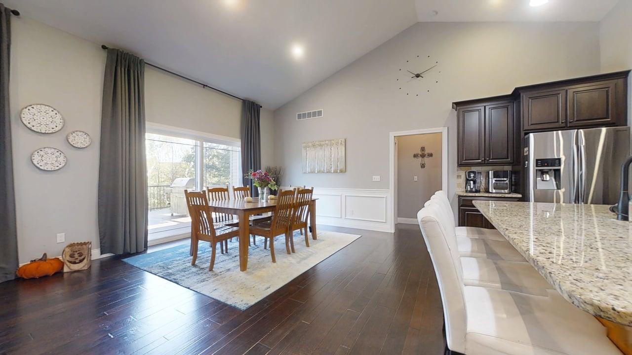 2112 Slade Lane Mahomet, IL 61853 - Photo 14 of 68 a view of a dining room with furniture and wooden floor