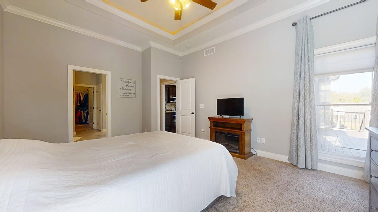 2112 Slade Lane Mahomet, IL 61853 - Photo 21 of 68 a bedroom with a bed and a flat screen tv