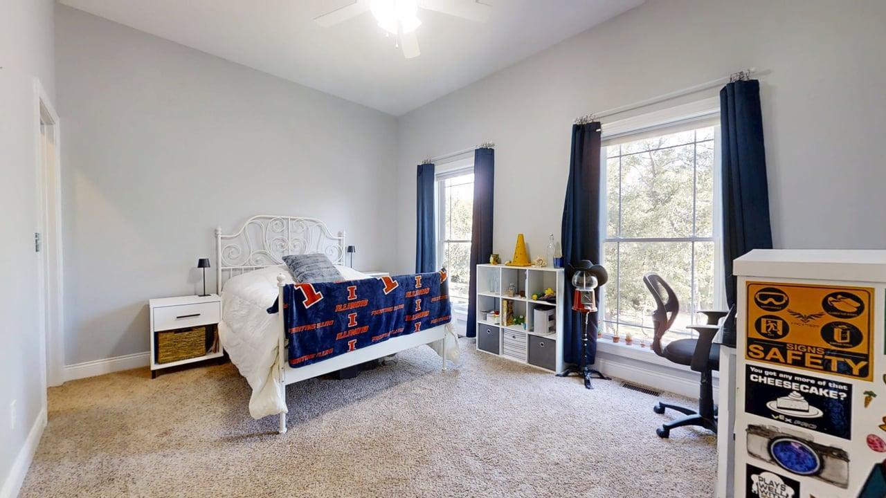 2112 Slade Lane Mahomet, IL 61853 - Photo 30 of 68 a bedroom with furniture and a window