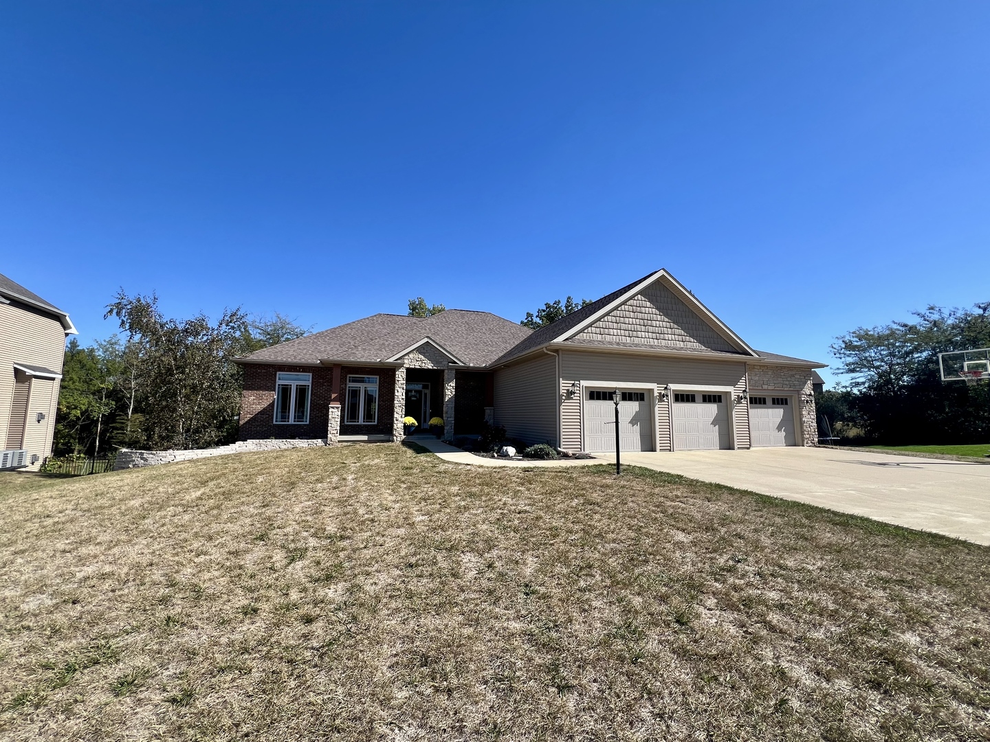 2112 Slade Lane Mahomet, IL 61853 - Photo 3 of 68 a front view of a house with a yard