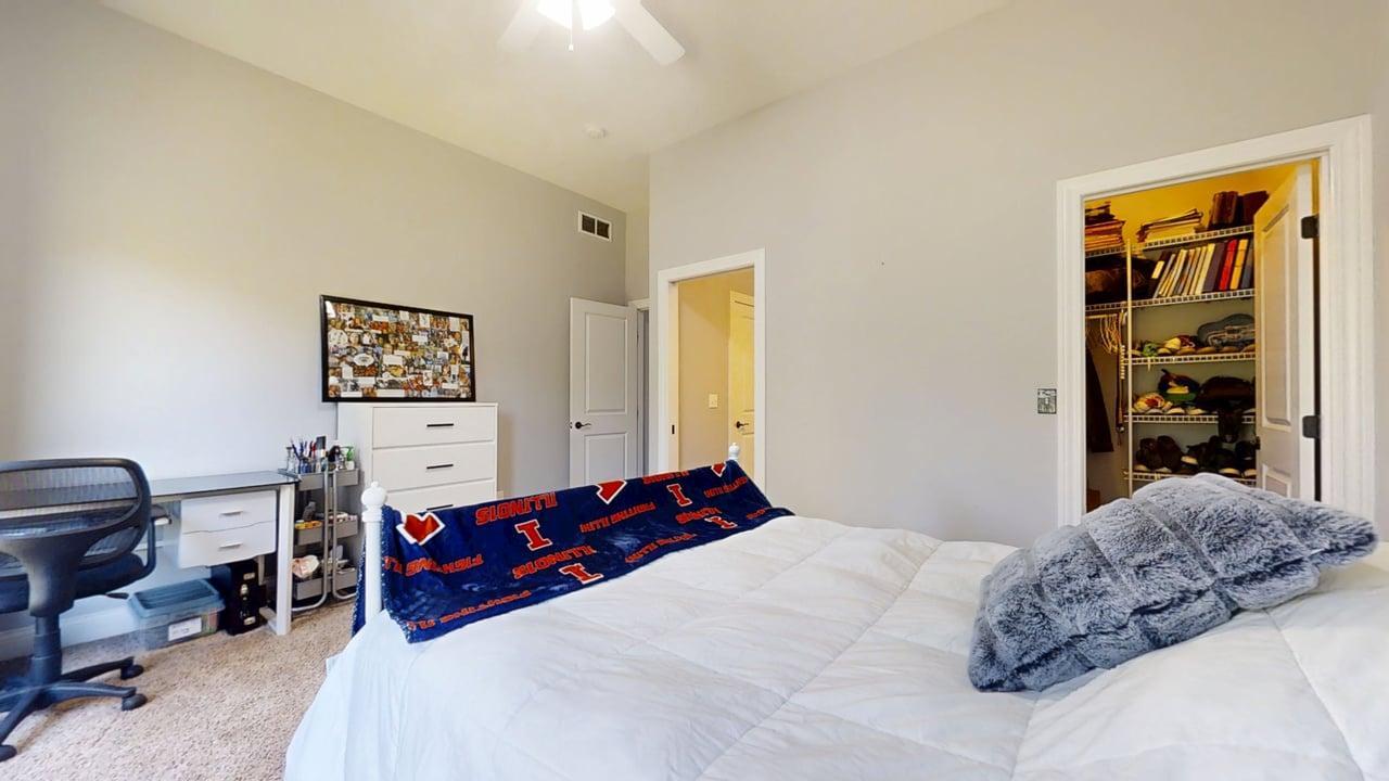 2112 Slade Lane Mahomet, IL 61853 - Photo 32 of 68 a bedroom with a bed and a closet
