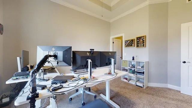 a bedroom with a bed and a chair