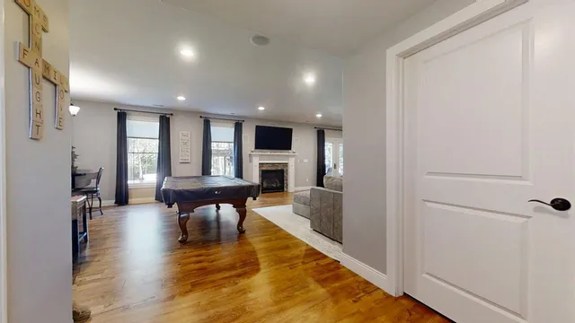 a bathroom with a sink a light fixture and a mirror