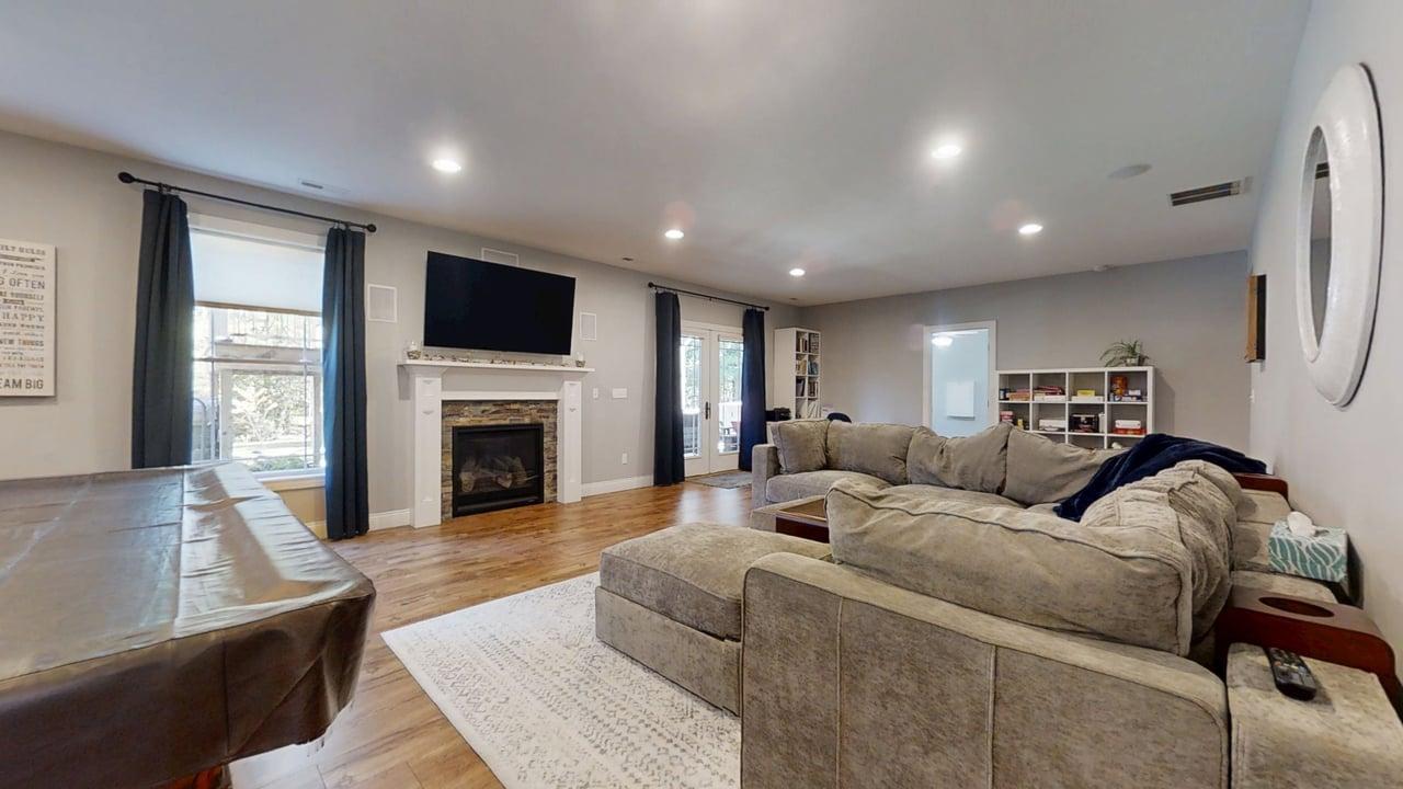2112 Slade Lane Mahomet, IL 61853 - Photo 39 of 68 a living room with furniture fireplace and flat screen tv