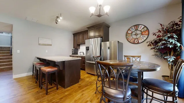 a view of a livingroom with furniture and a flat screen tv