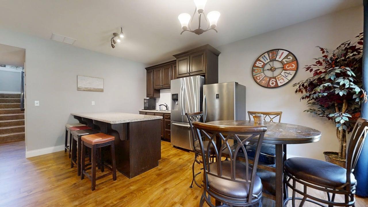 2112 Slade Lane Mahomet, IL 61853 - Photo 40 of 68 a dining room with furniture and wooden floor