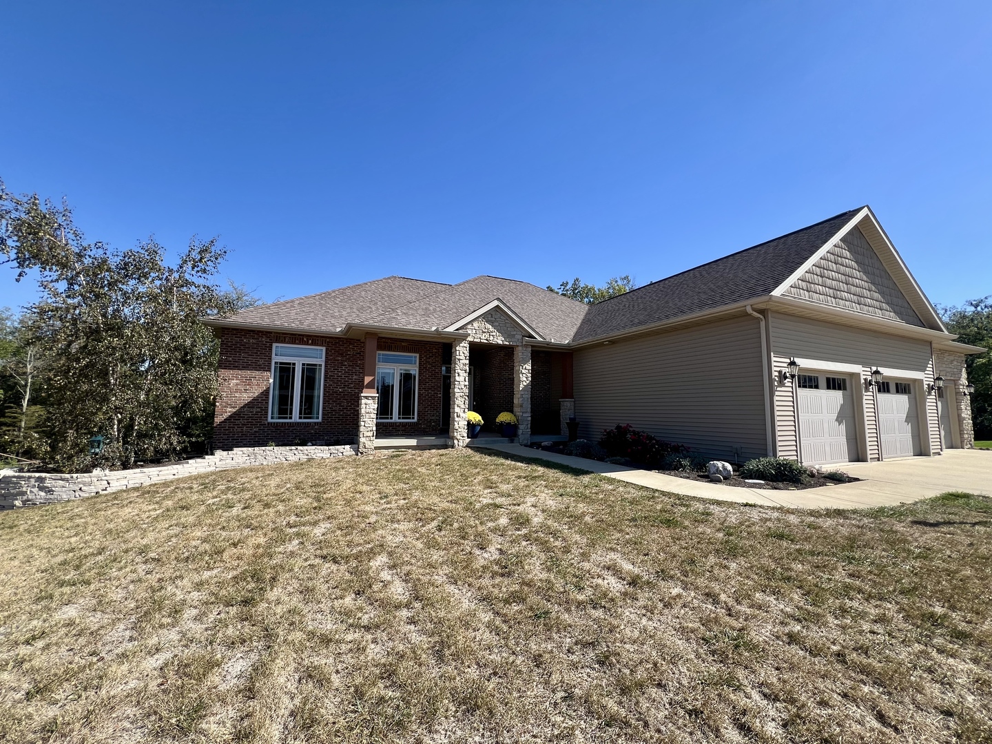 2112 Slade Lane Mahomet, IL 61853 - Photo 4 of 68 a front view of a house with a yard