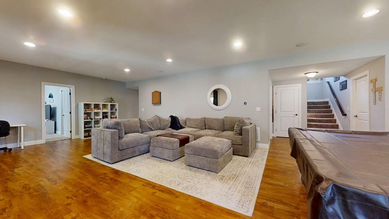 2112 Slade Lane Mahomet, IL 61853 - Photo 42 of 68 a living room with furniture and a wooden floor