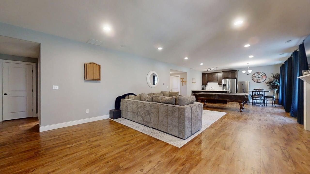 2112 Slade Lane Mahomet, IL 61853 - Photo 44 of 68 a living room with furniture and a wooden floor