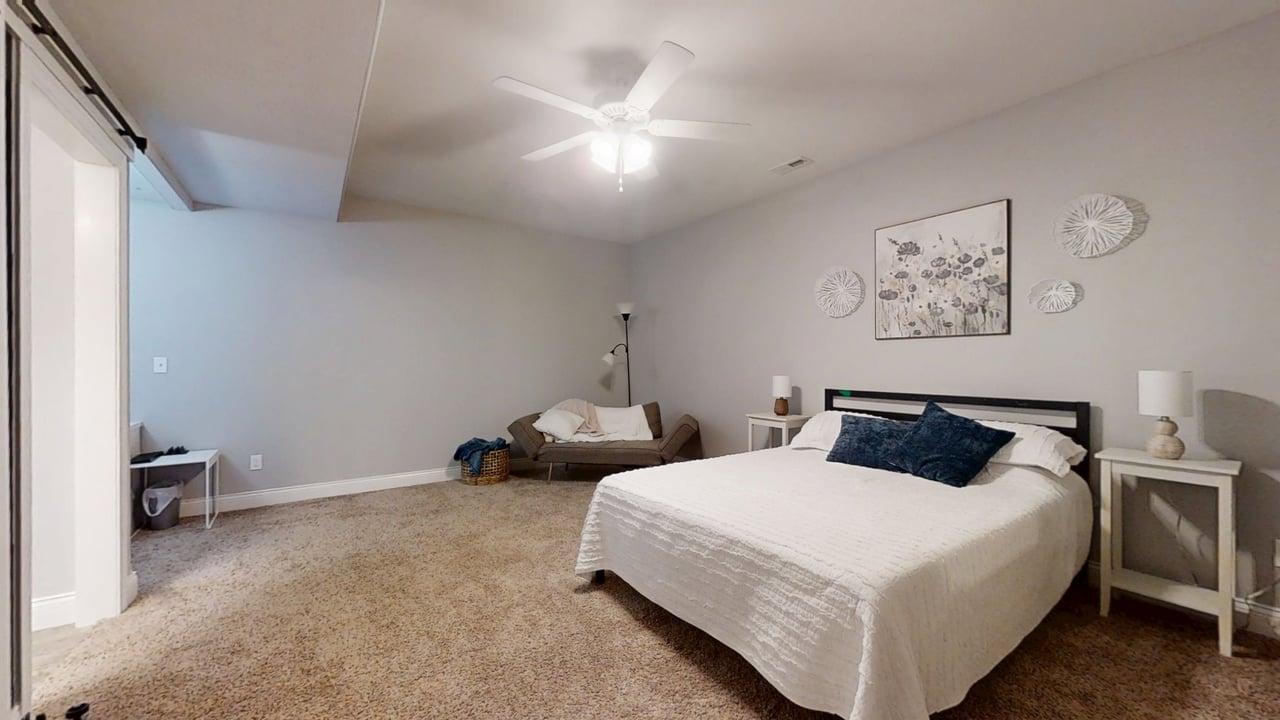 2112 Slade Lane Mahomet, IL 61853 - Photo 46 of 68 a bedroom with a bed and a chair