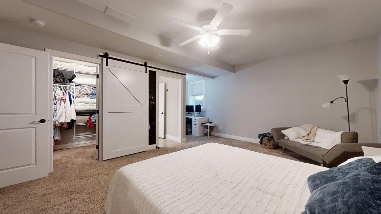 2112 Slade Lane Mahomet, IL 61853 - Photo 48 of 68 a bedroom with a bed and a large mirror